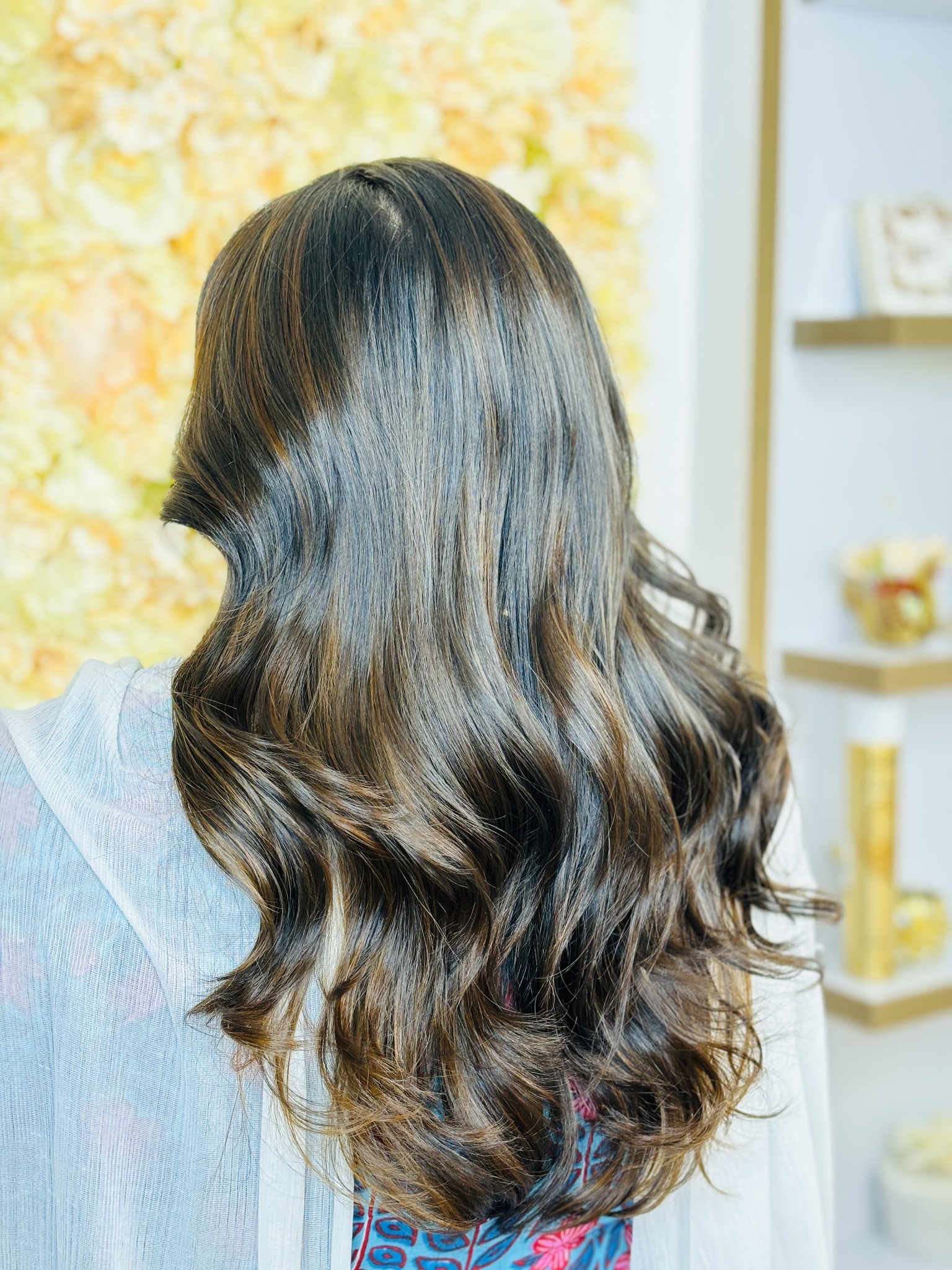 Long, wavy hair with colour highlights at Greatlooks Salon